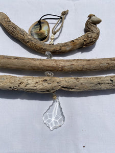 Baby Shells, Large Crystal, and Carlsbad Driftwood Suncatcher (Large vintage crystal, small shells, and clear chandelier crystals) (18" W x 9" L)