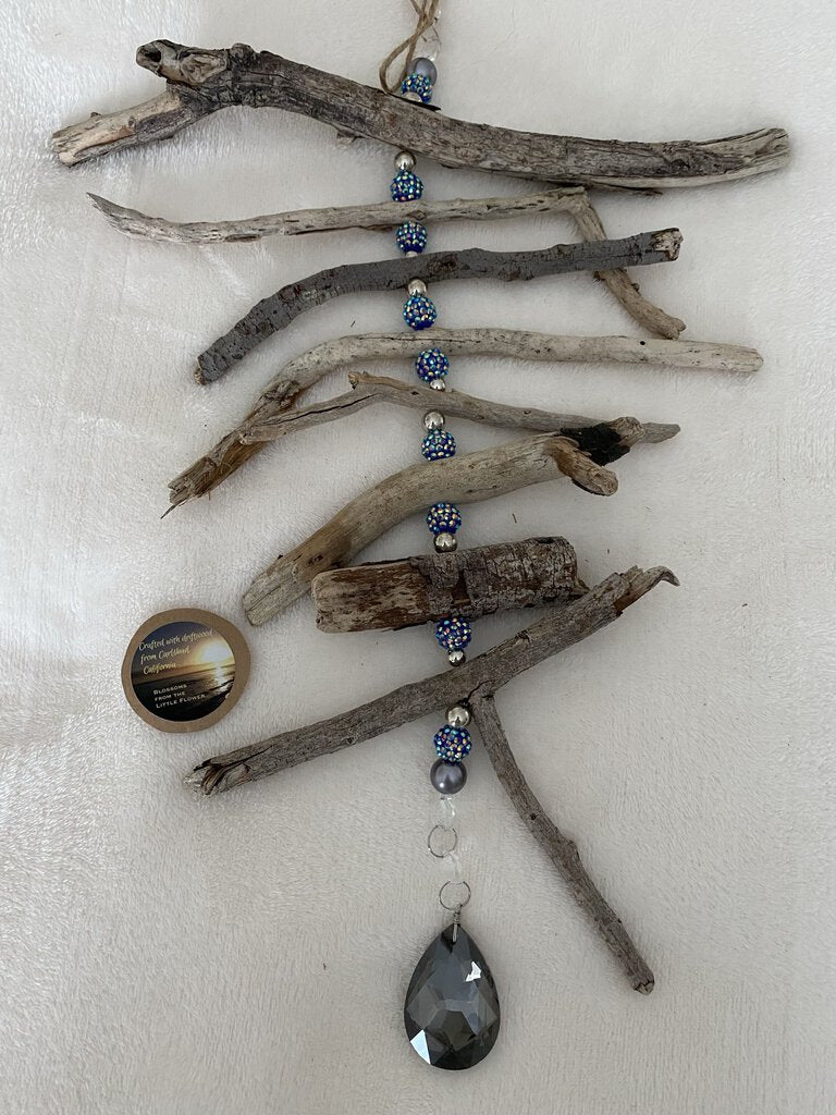 Blue and silver sparkly beads, silver crystal, and driftwood suncatcher