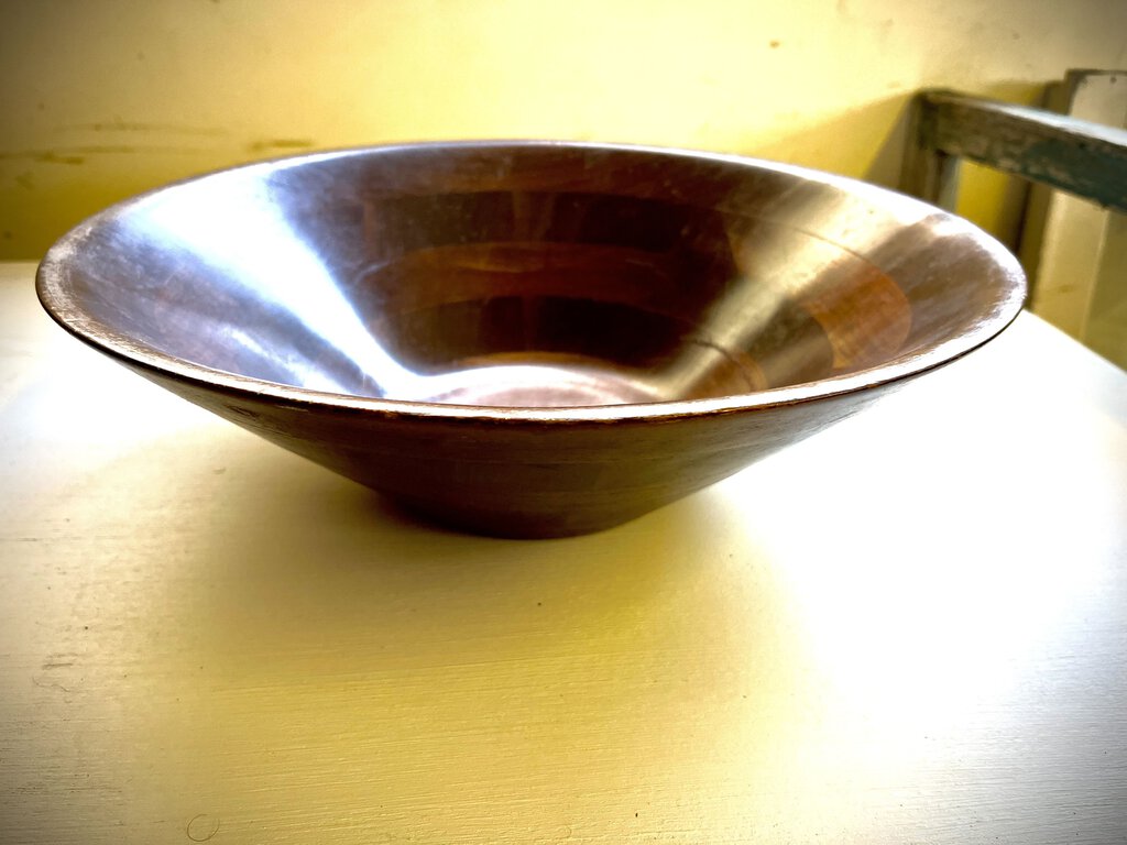 Dark brown wood salad bowl