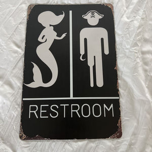 mermaid/pirate restroom sign
